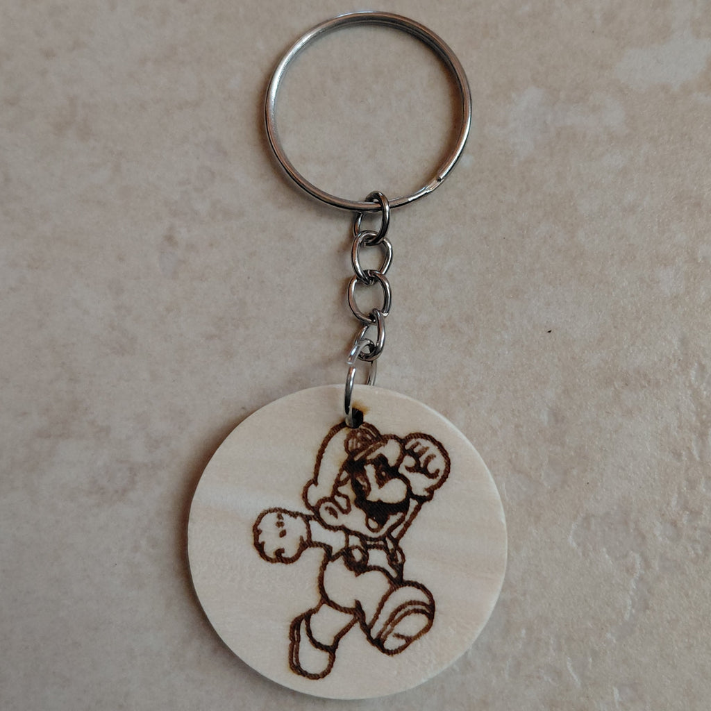 Llavero artesano de madera grabado a láser con la imagen de Super Mario Bros