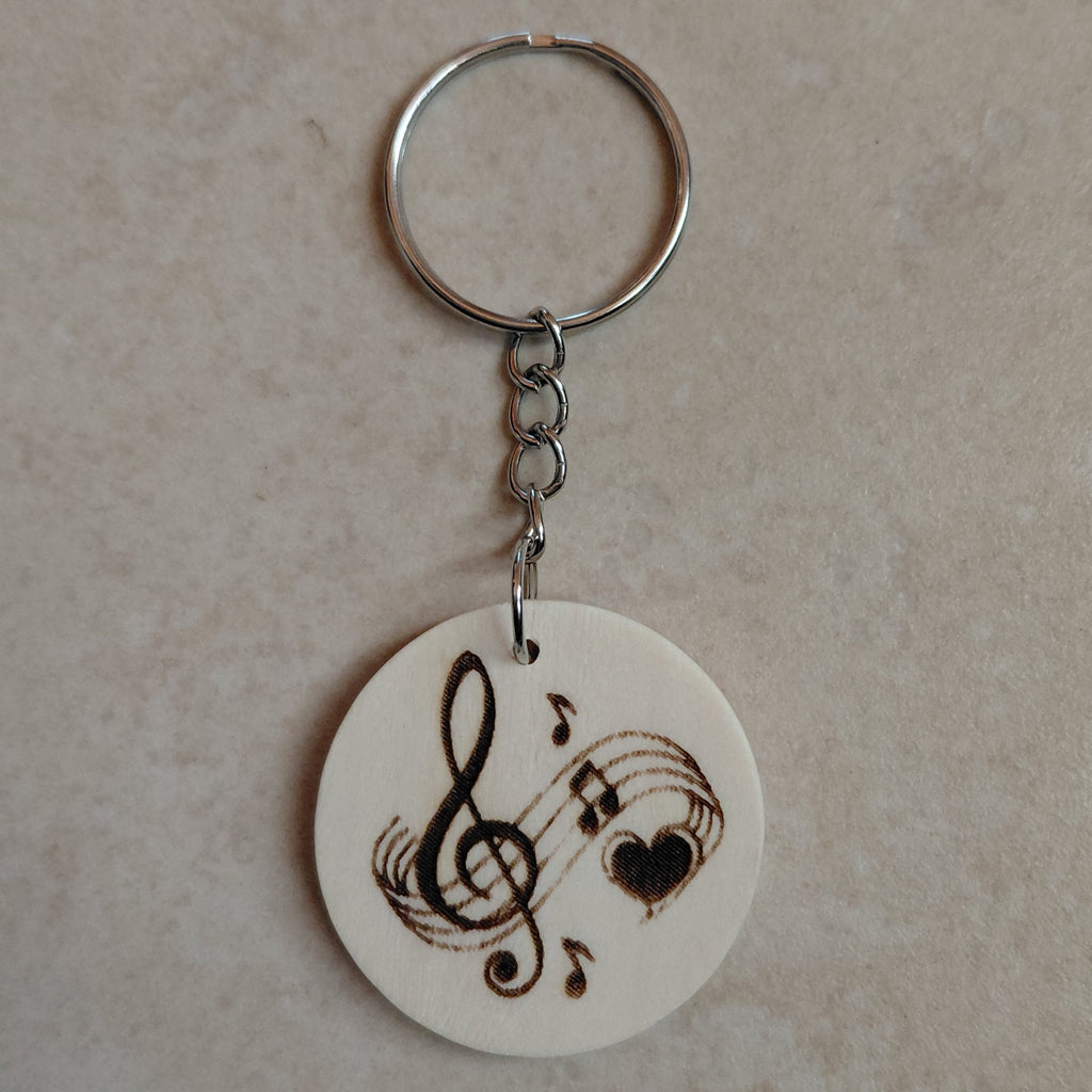 Llavero artesano de madera grabado a láser con una imagen ideal para los amantes de la música