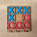 Hermoso juego de mesa artesanal que representa el tradicional tic tac toe o tres en raya. Regalo perfecto de madera, tecnica de corte y grabado laser, pintado a mano.